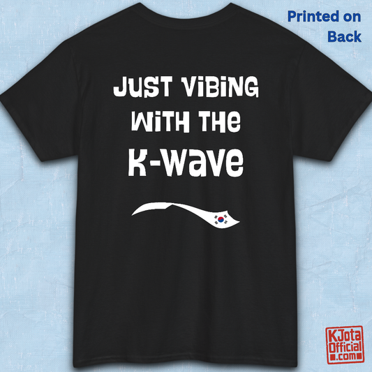 Black t-shirt flatlay with “Just vibing with the K-Wave” printed on back. Korean pop culture fandom t-shirt by K-Jota
