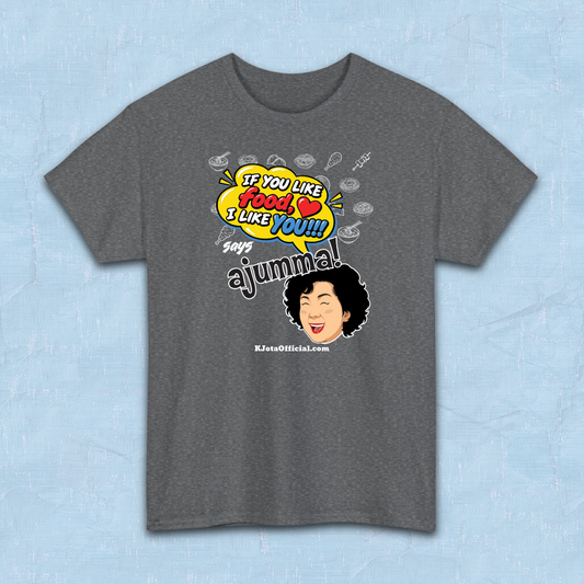 gray t-shirt flatlay with a comic-style yellow speech bubble reading 'If You Like Food, I Like You!!!' above a laughing Korean ajumma illustration and hand-drawn Korean food icons by K-Jota