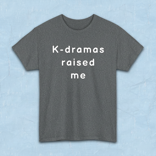 Gray t-shirt for Korean show fans with 'K-dramas raised me' text on a light blue background by Kjota