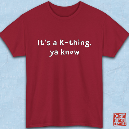 “It’s a K-thing, Ya Know” printed on red t-shirt flatlay by K-Jota