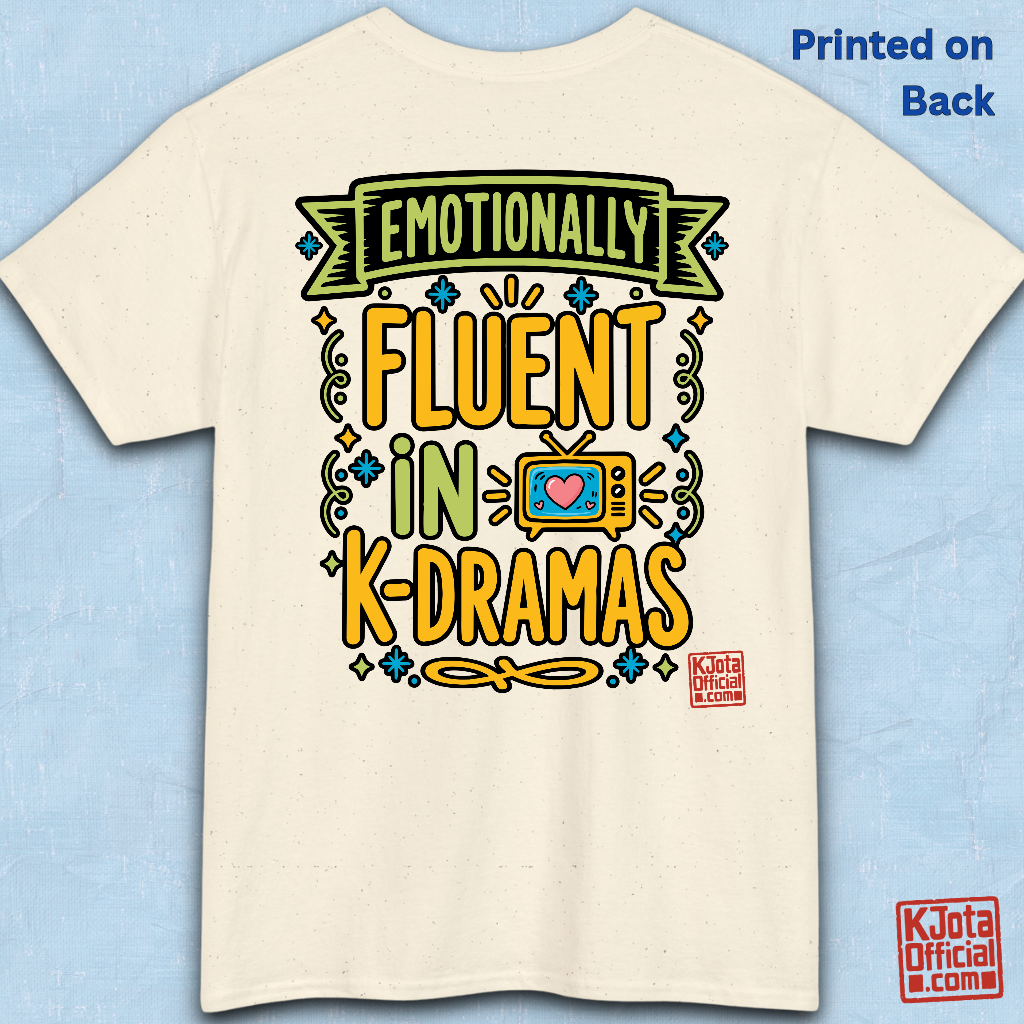 “Emotionally Fluent in K-Dramas” printed on front of tee, Korean show superfan identity binge watching t-shirt beige backside flatlay by K-Jota