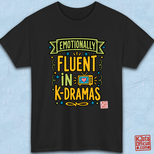 “Emotionally Fluent in K-Dramas” printed on front of tee, Korean show superfan identity binge watching t-shirt black flatlay by K-Jota