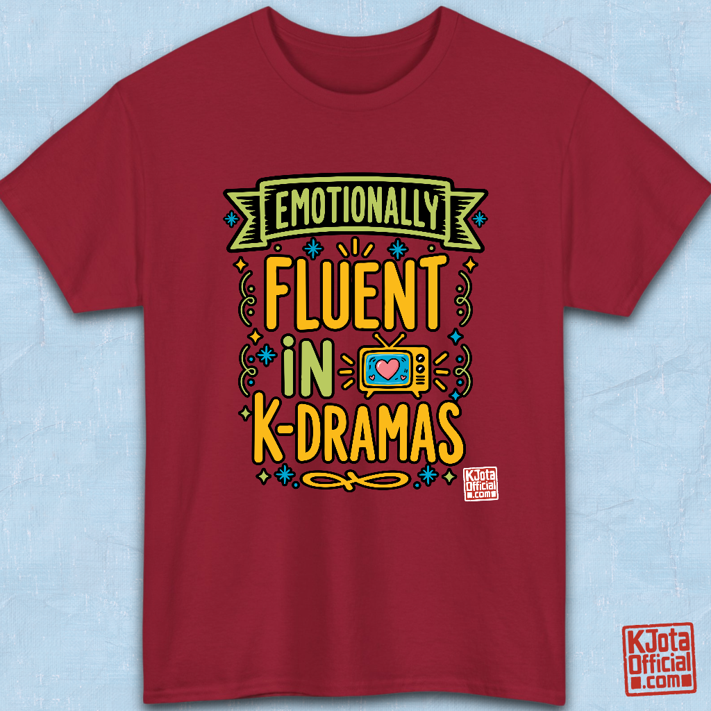 “Emotionally Fluent in K-Dramas” printed on front of tee, Korean show superfan identity binge watching t-shirt red flatlay by K-Jota