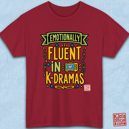 “Emotionally Fluent in K-Dramas” printed on front of tee, Korean show superfan identity binge watching t-shirt red flatlay by K-Jota