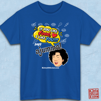 blue t-shirt flatlay with a comic-style yellow speech bubble reading 'If You Like Food, I Like You!!!' above a laughing Korean ajumma illustration and hand-drawn Korean food icons by K-Jota