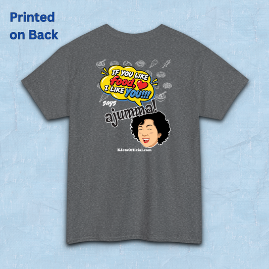 gray t-shirt backside flatlay with a comic-style yellow speech bubble reading 'If You Like Food, I Like You!!!' above a laughing Korean ajumma illustration and hand-drawn Korean food icons by K-Jota