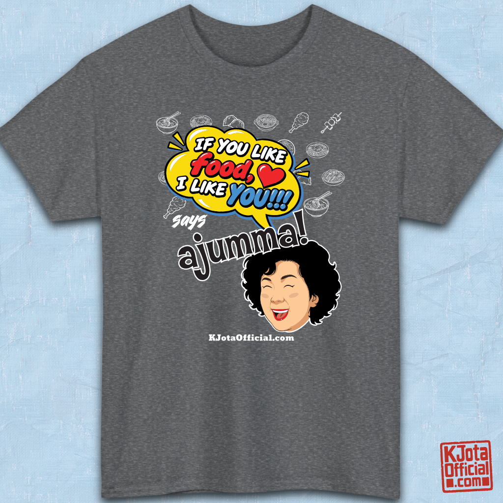 gray t-shirt flatlay with a comic-style yellow speech bubble reading 'If You Like Food, I Like You!!!' above a laughing Korean ajumma illustration and hand-drawn Korean food icons by K-Jota