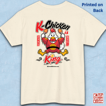 K-Chicken is King graphic t-shirt in beige featuring a Korean chicken mascot wearing a red royal robe and holding fried chicken drumsticks with Hangeul text by K-Jota.  Backside flatlay.