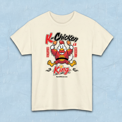 K-Chicken is King graphic t-shirt in beige featuring a Korean fried chicken mascot wearing red royal robes holding fried chicken drumsticks with Hangeul text by Kjota