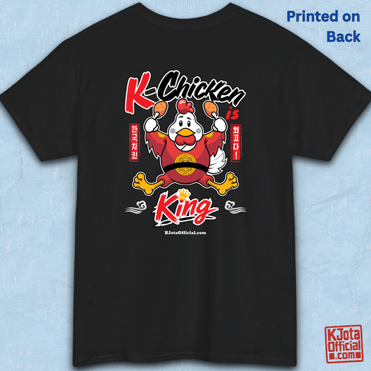 K-Chicken is King graphic t-shirt in black featuring a Korean chicken mascot wearing a red royal robe and holding fried chicken drumsticks with Hangeul text by K-Jota.  Backside flatlay.