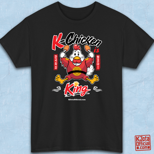 K-Chicken is King graphic t-shirt flatlay by K-Jota in black featuring a Korean fried chicken mascot wearing a red royal robe holding fried chicken drumsticks with Hangeul text
