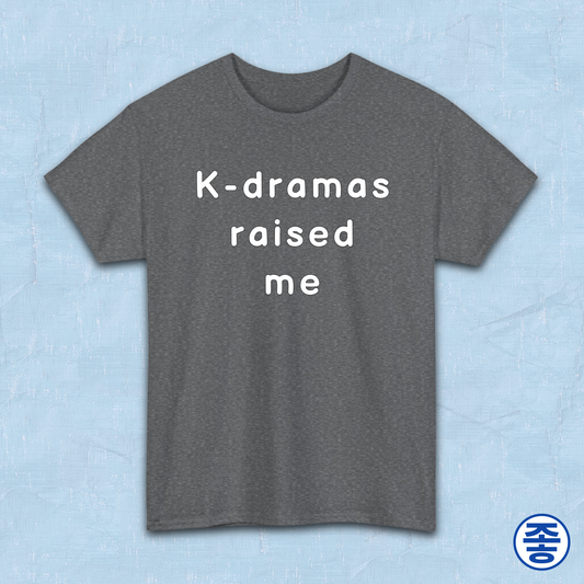 Gray t-shirt for Korean show fans with 'K-dramas raised me' text on a light blue background by Kjota