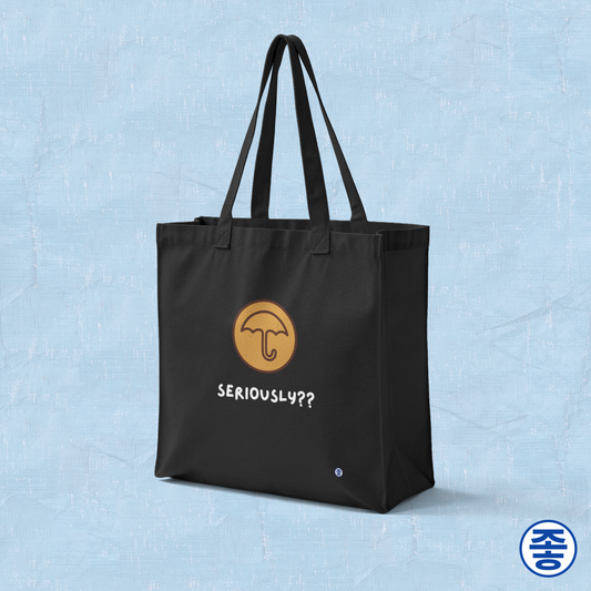 Squid Game inspired dalgona honeycomb candy umbrella Korean street snack design on black canvas tote bag by Kjota