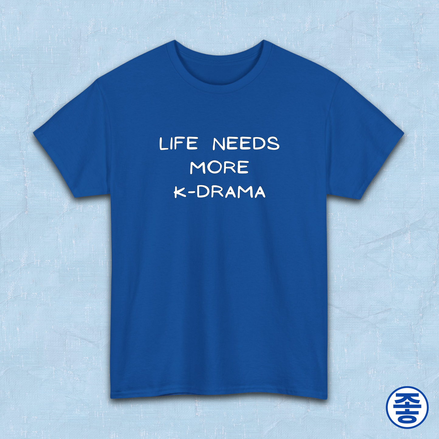 Blue t-shirt for Korean show fans with 'LIFE NEEDS MORE K-DRAMA' text on a light blue background by Kjota