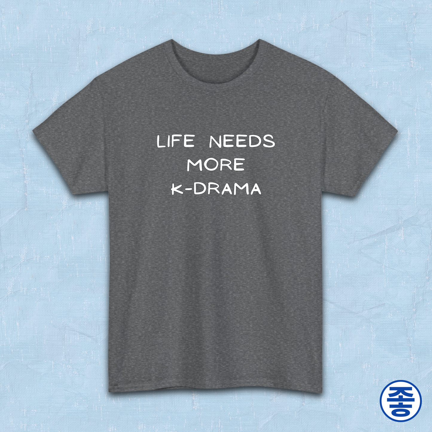 Gray t-shirt for Korean show fans with 'LIFE NEEDS MORE K-DRAMA' text on a light blue background by Kjota