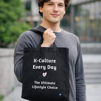 man holding “K-culture every day the ultimate lifestyle choice” Korean Wave Hallyu 한류 fandom black canvas tote bag by Kjota