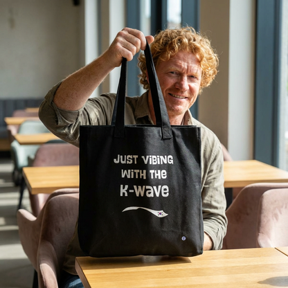 Just vibing with the K-Wave Korean pop culture hallyu fandom man holding black canvas tote bag by Kjota