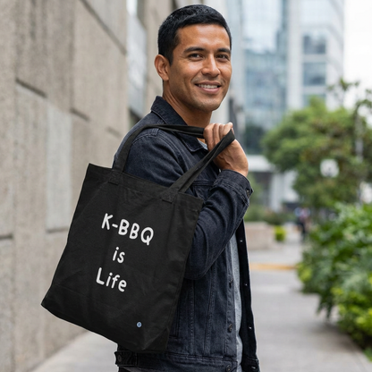 K-BBQ is life for Korean food fans man holding a black canvas tote bag by Kjota