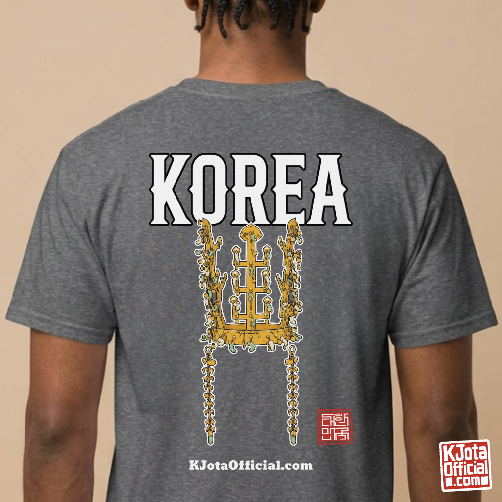 man wearing a gray t-shirt by K-Jota with image of gold crown from Korea’s Silla dynasty printed on the back