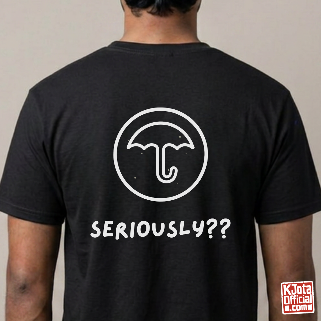 man wearing a black t-shirt with Dalgona candy umbrella design printed on back. Inspired by Squid Game Korean street snack honeycomb candy. K-fandom merch by K-Jota