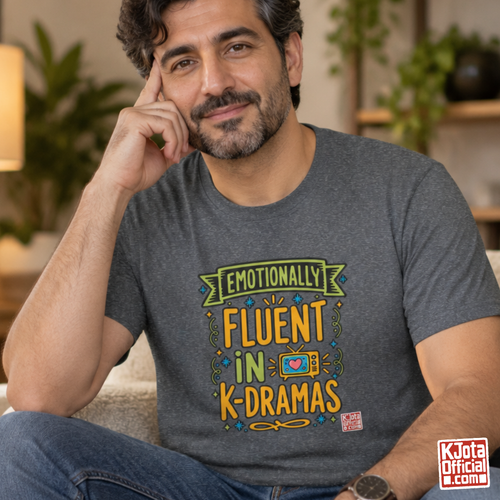 man wearing a gray tee with “Emotionally Fluent in K-Dramas” printed on front, Korean show superfan identity binge watching t-shirt by K-Jota