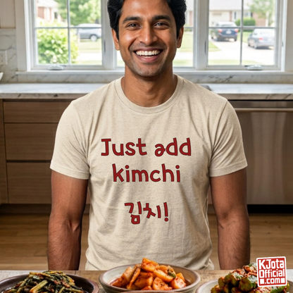 man wearing a beige t-shirt with “Just add kimchi” printed on front by K-Jota