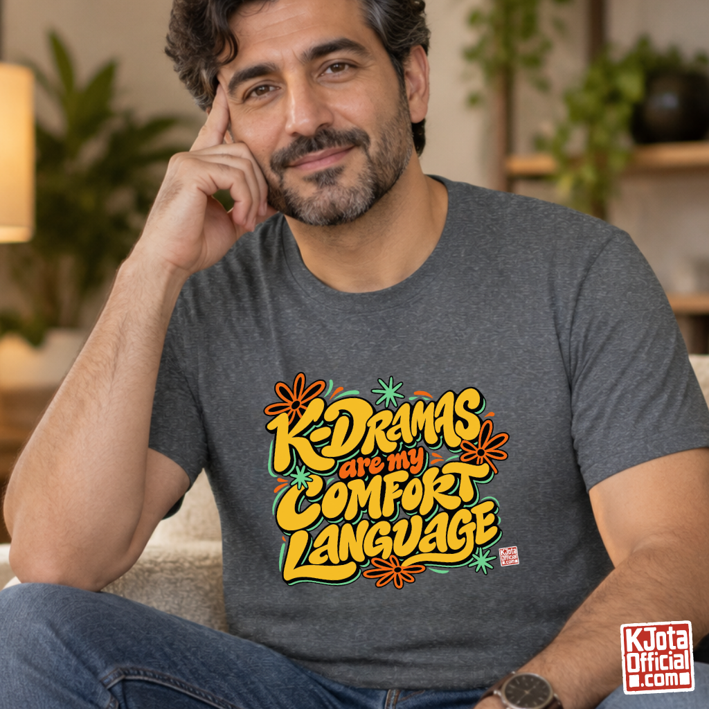 man wearing a gray t-shirt with “K-Dramas Are My Comfort Language” printed on front by K-Jota