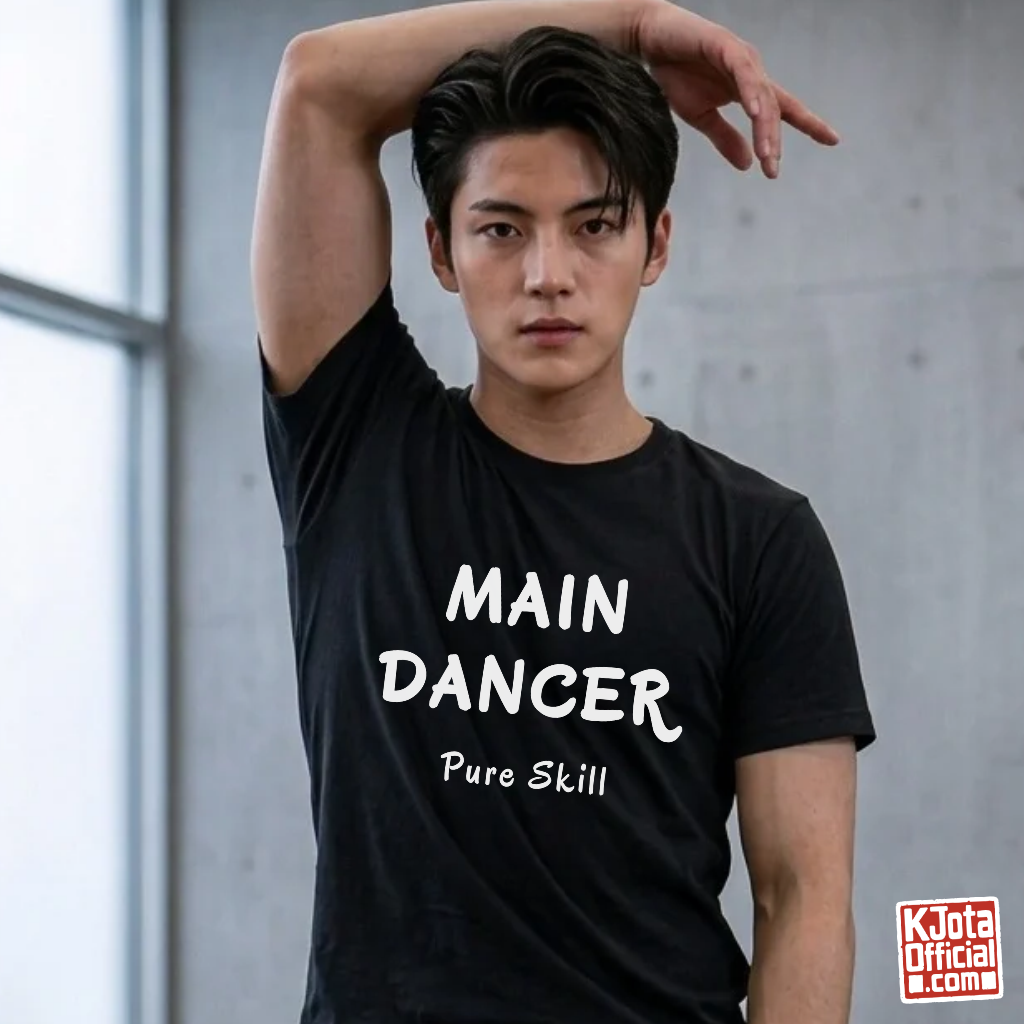 man wearing a K-pop group member role t-shirt with “Main Dancer Pure Skill” printed on front. Black tee by K-Jota