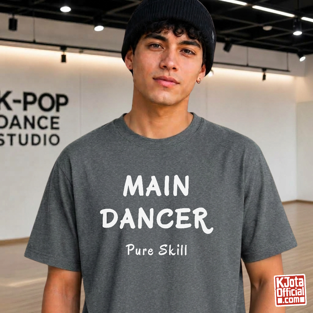man wearing a K-pop group member role t-shirt with “Main Dancer Pure Skill” printed on front. Gray tee by K-Jota