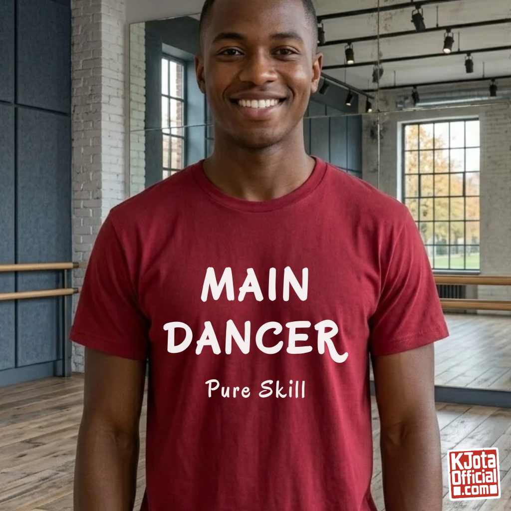 man wearing a K-pop group member role t-shirt with “Main Dancer Pure Skill” printed on front. Red tee by K-Jota