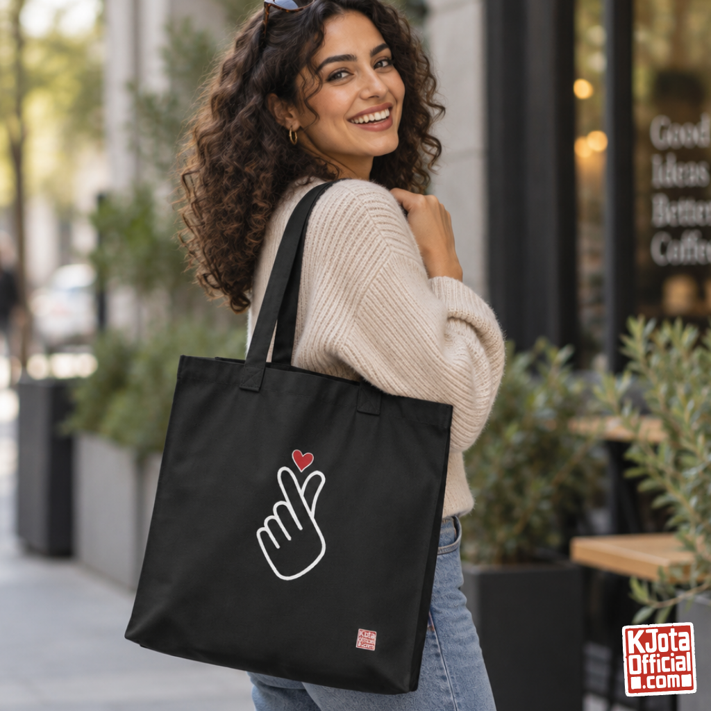 woman holding a finger heart Korean saranghaeyo I love you K-pop fan black canvas tote bag for photocard trading events by K-Jota
