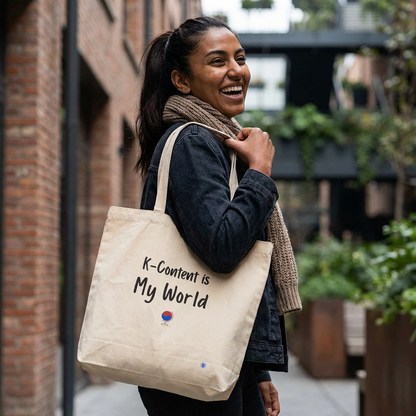woman holding K-content is my world Korean entertainment Hallyu fan canvas tote bag beige by Kjota