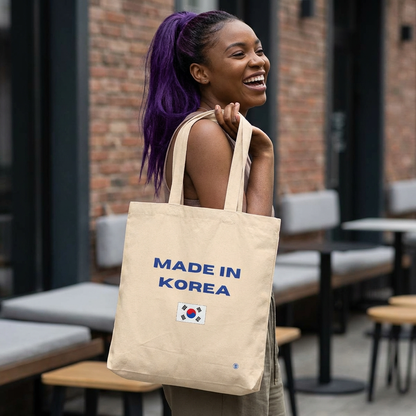 woman holding Made in Korea Korean culture pride Hallyu 한류 and travel beige canvas tote bag by Kjota