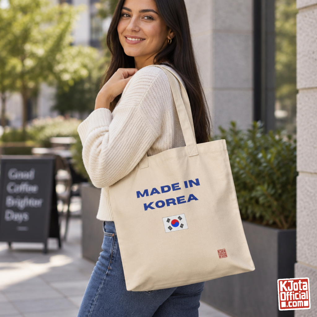 woman holding a “Made in Korea” Korean culture fandom travel black canvas tote bag by K-Jota