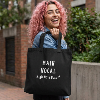woman holding a Main Vocal high note K-pop fan beige canvas tote bag for photocard trading events  by Kjota