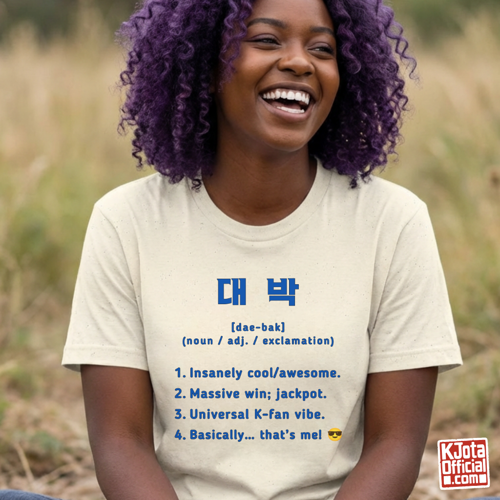 woman wearing Daebak 대박 Korean slang Hangeul text definition meaning awesome or amazing beige t-shirt by K-Jota
