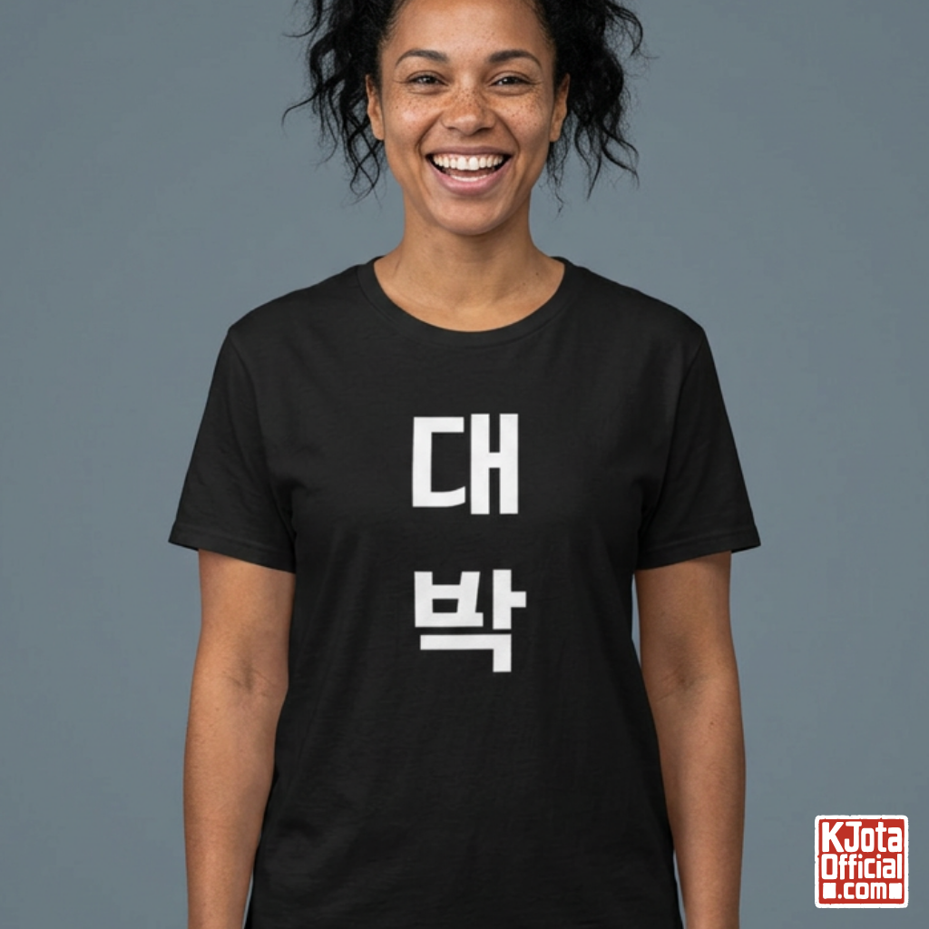 woman wearing a black t-shirt with “대박” Daebak Korean text printed on front by K-Jota