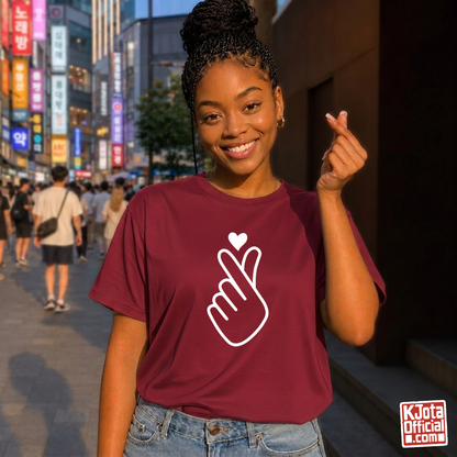 woman wearing finger heart Korean saranghaeyo I love you K-pop fan t-shirt red by K-Jota and making finger heart gesture in Korean city street
