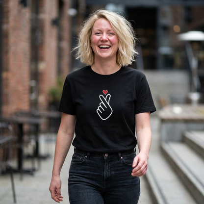 woman wearing finger heart Korean saranghaeyo K-pop fan t-shirt black by Kjota