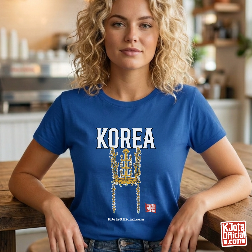 woman wearing a blue t-shirt by K-Jota with image of gold crown from Korea’s Silla dynasty printed on the front