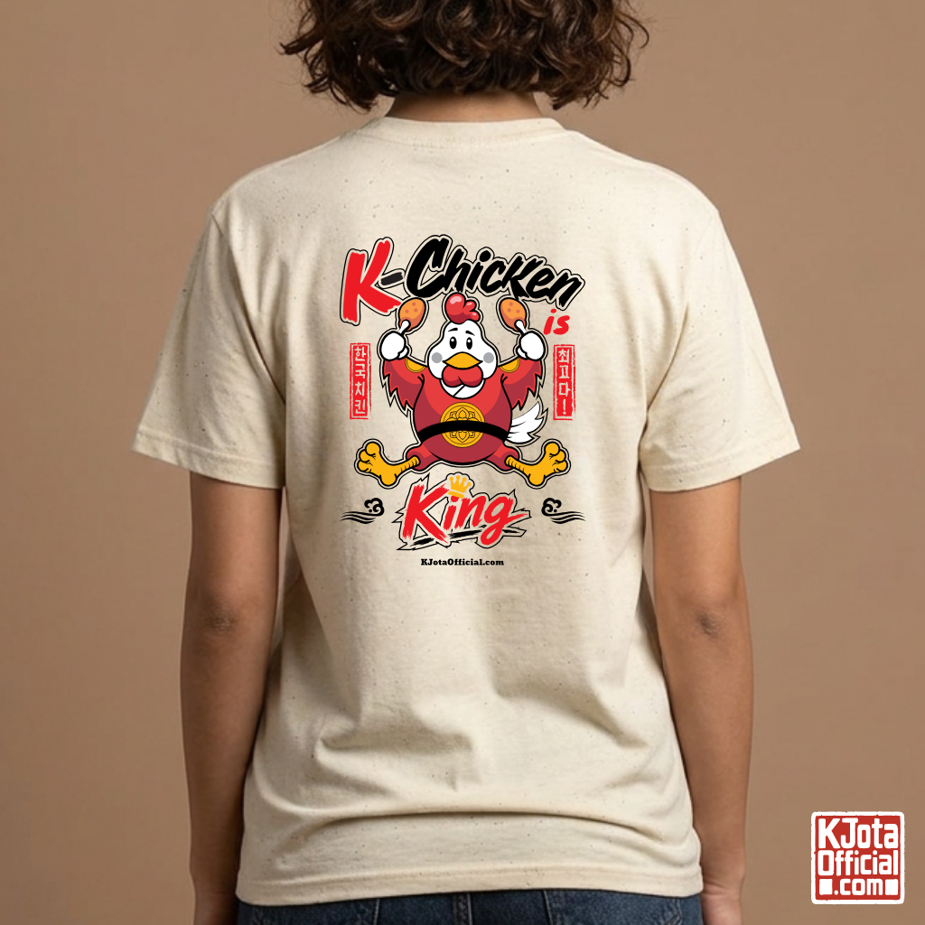 woman wearing K-Chicken is King graphic beige t-shirt featuring a Korean chicken mascot wearing a red royal robe and holding fried chicken drumsticks with Hangeul text printed on back of tee by K-Jota