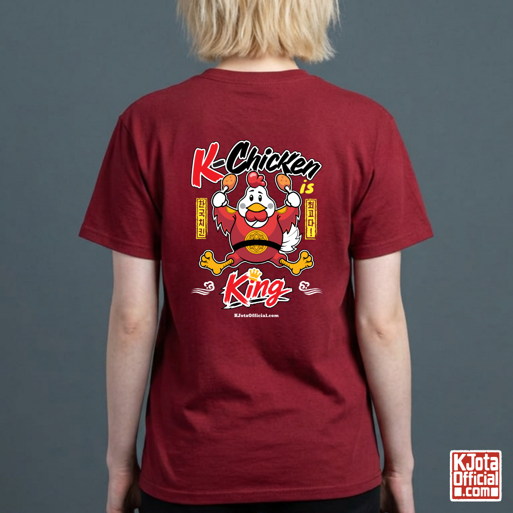 woman wearing “K-Chicken is King” graphic red t-shirt featuring a Korean chicken mascot wearing a red royal robe and holding fried chicken drumsticks with Hangeul text printed on back of tee by K-Jota