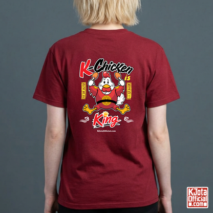woman wearing “K-Chicken is King” graphic red t-shirt featuring a Korean chicken mascot wearing a red royal robe and holding fried chicken drumsticks with Hangeul text printed on back of tee by K-Jota