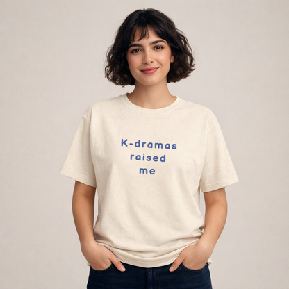 woman wearing beige t-shirt for Korean show fans with 'K-dramas raised me' text by Kjota