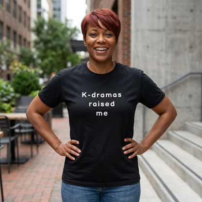 woman wearing black t-shirt for Korean show fans with 'K-dramas raised me' text by Kjota