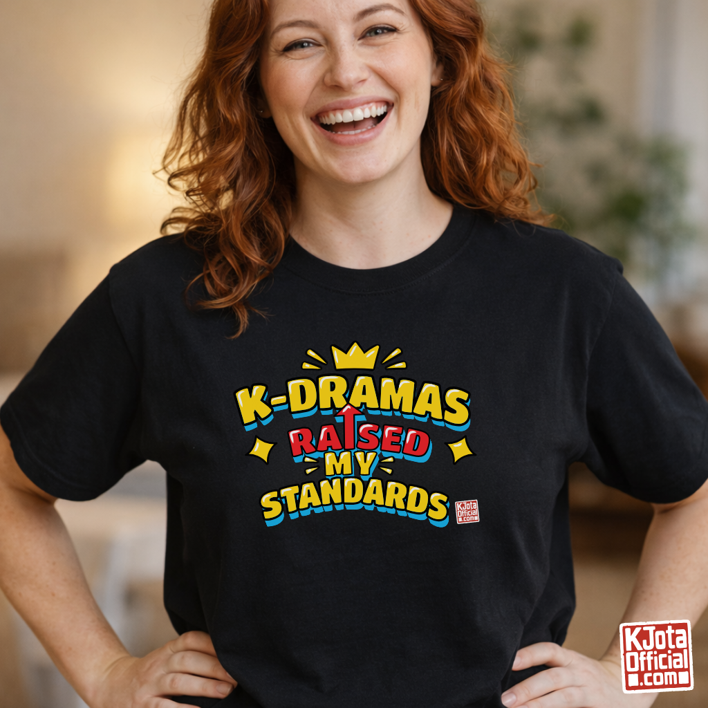 woman wearing a black t-shirt with 'K-DRAMAS RAISED MY STANDARDS' printed on the front. Realistic expectations K-fan graphic tee by K-Jota