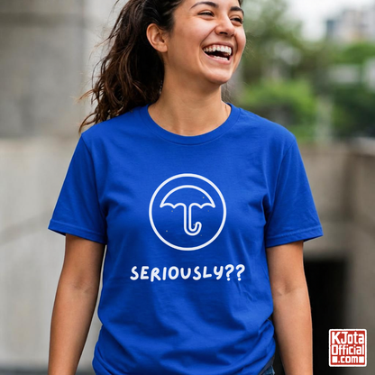 woman wearing a blue t-shirt with Dalgona candy umbrella design inspired by Squid Game Korean street snack honeycomb candy. K-fandom merch by K-Jota