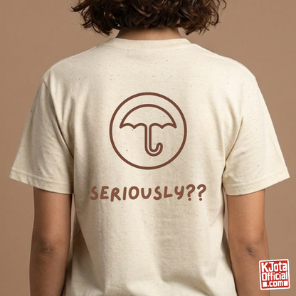 woman wearing a beige t-shirt with Dalgona candy umbrella design printed on back. Inspired by Squid Game Korean street snack honeycomb candy. K-fandom merch by K-Jota