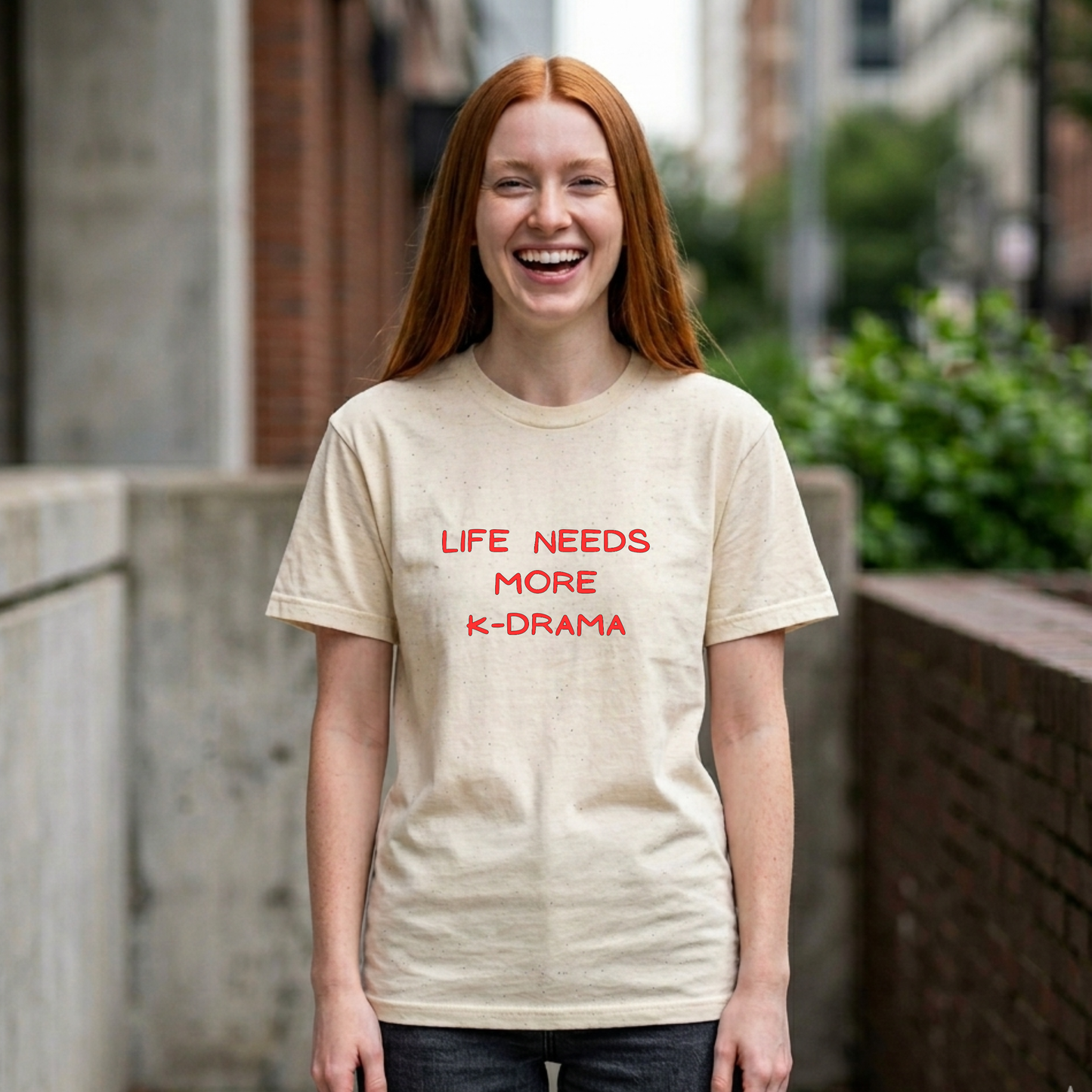 woman wearing beige t-shirt for Korean show fans with 'LIFE NEEDS MORE K-DRAMA' text by Kjota