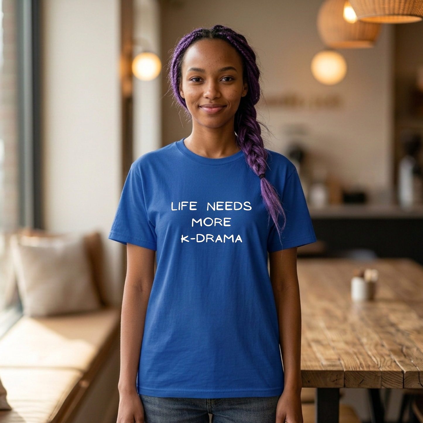 woman wearing blue t-shirt for Korean show fans with 'LIFE NEEDS MORE K-DRAMA' text by Kjota